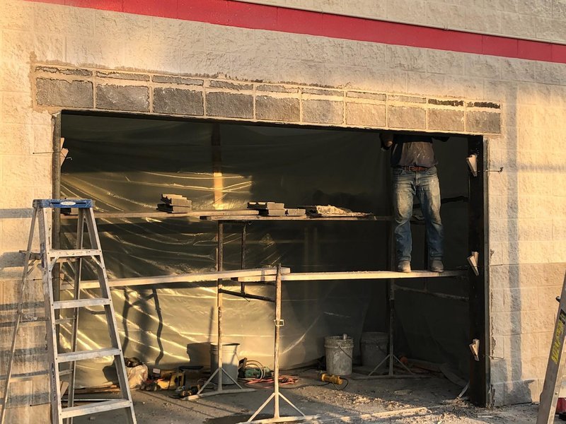Exterior masonry wall opening in progress